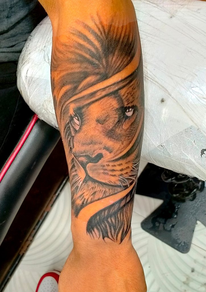The Majestic Roar: Lion Tattoo by Gupta Tattoo Studio